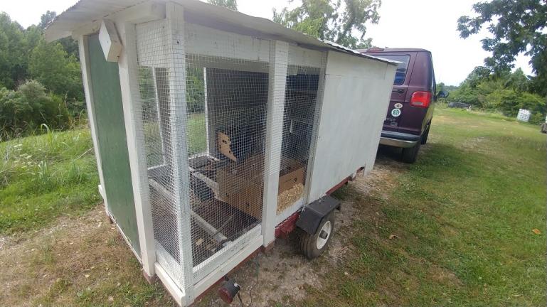 Moving our mobile chicken coop into it's 1st location 7-15-19