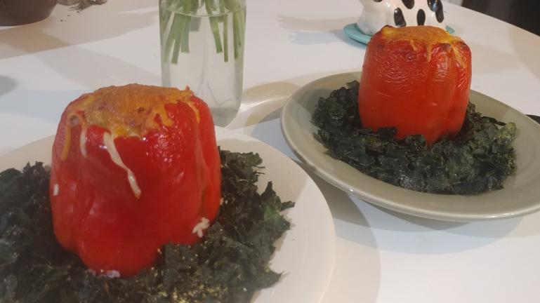 Stuffed red peppers on a bed of baked kale    8-30-19