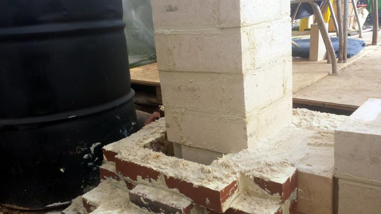 Refractory Cemented Brick Foundation for Burn Barrel with a Sand Gasket